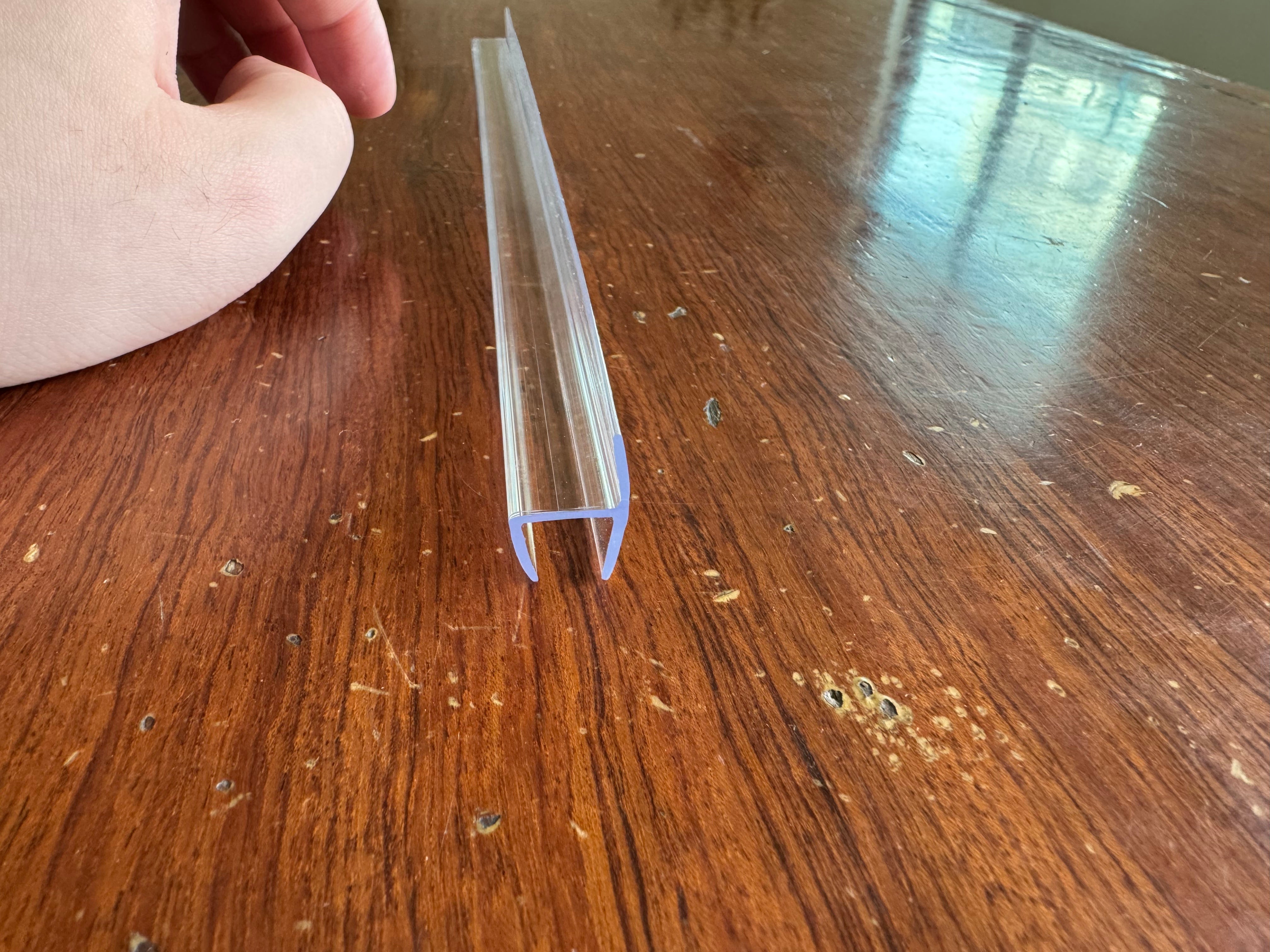 PCC120: Polycarbonate "H" jamb with hard leg for 180 degree. For 1/2" Glass. 95" length.